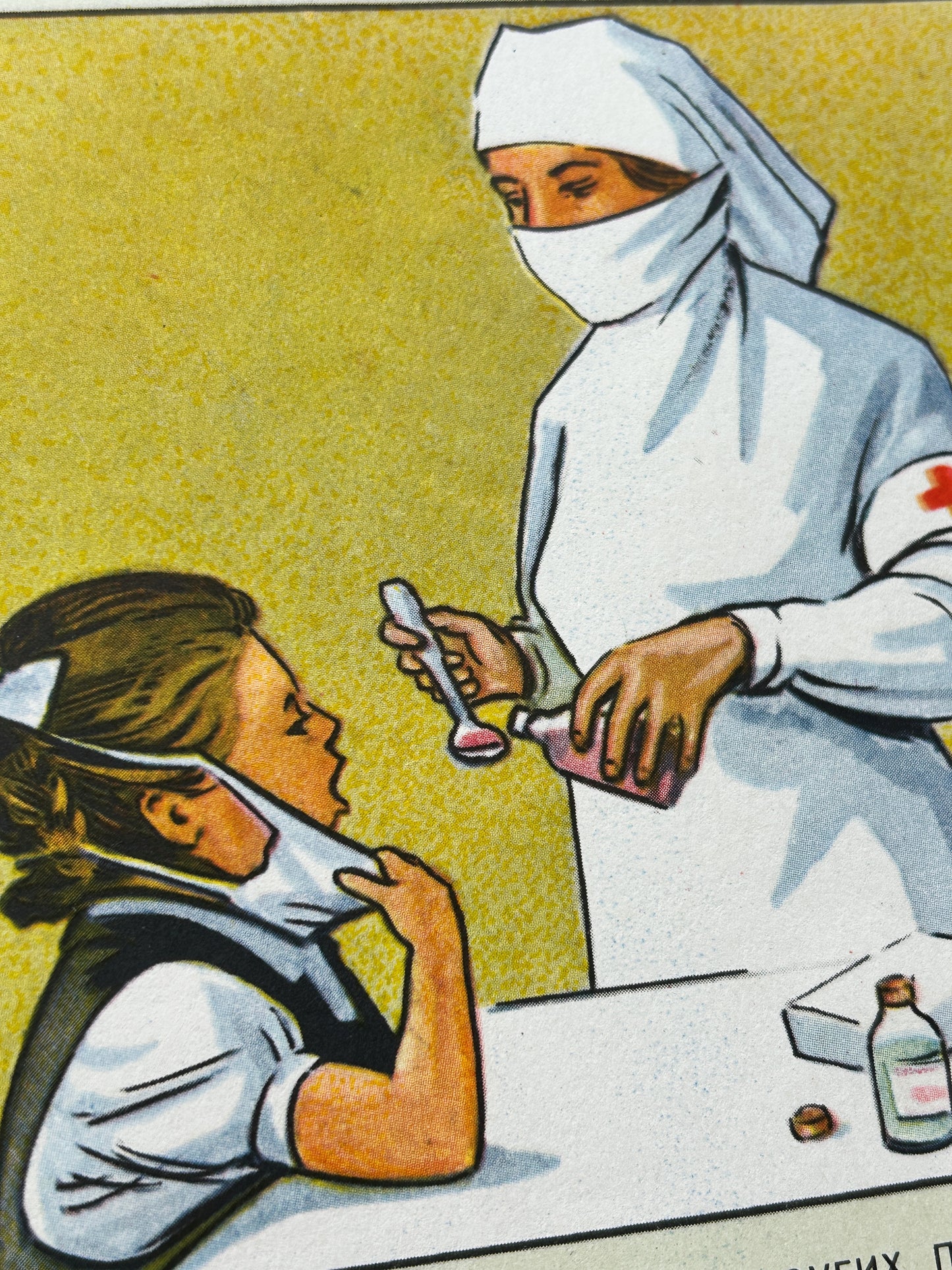 Detail of a USSR vintage poster: an illustration showing a nurse in white administering medicine to a seated girl at a table, with a yellow background and medical props on the table.