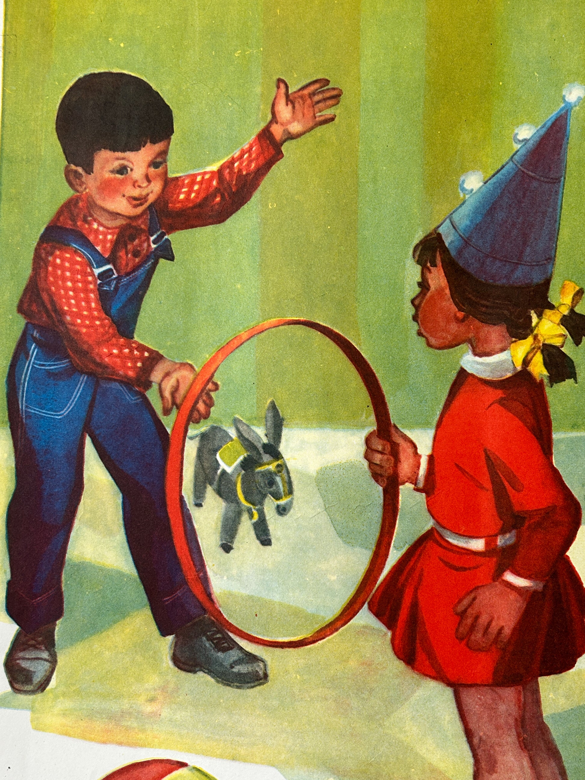 Vintage children's illustration showing a boy in a red patterned shirt and blue overalls holding a red hoop with a small stuffed animal inside, facing a girl in a red dress and blue pointed hat - detail of a 1970s USSR vintage alphabet poster.