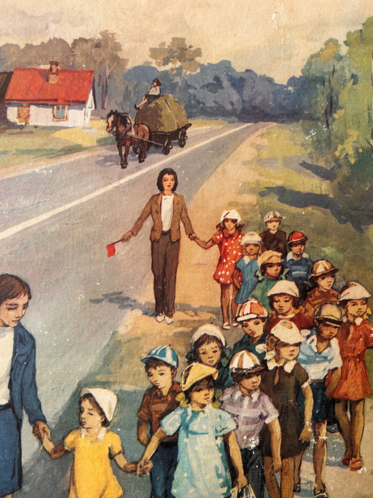 Detail of a vintage USSR illustrated road safety poster: a countryside scene showing a group of children and teachers walking along a country road, with a horse-drawn carriage in the distance.