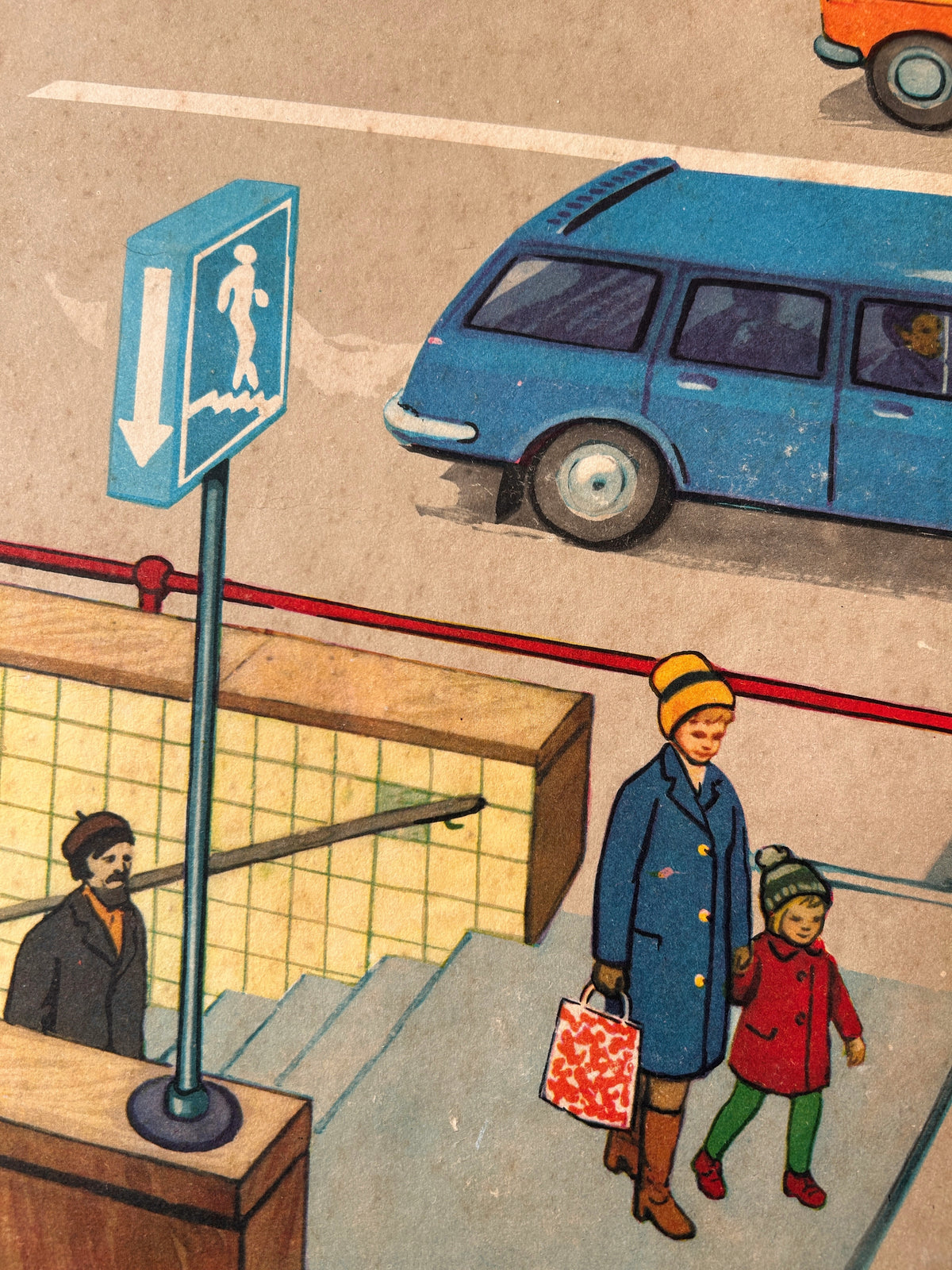 Detail of a vintage USSR illustrated road safety poster: a street scene showing a parent and a child coming out of an underground pedestrian crossing.
