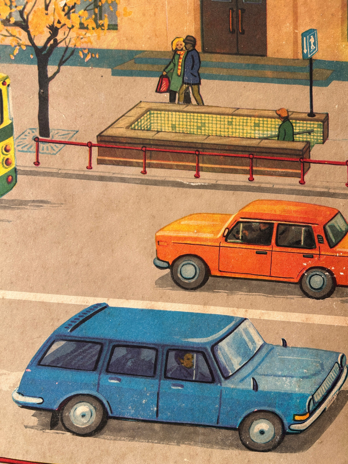 Detail of a vintage USSR illustrated road safety poster: a street scene showing cars and an underground pedestrian crossing across the road with pedestrians.